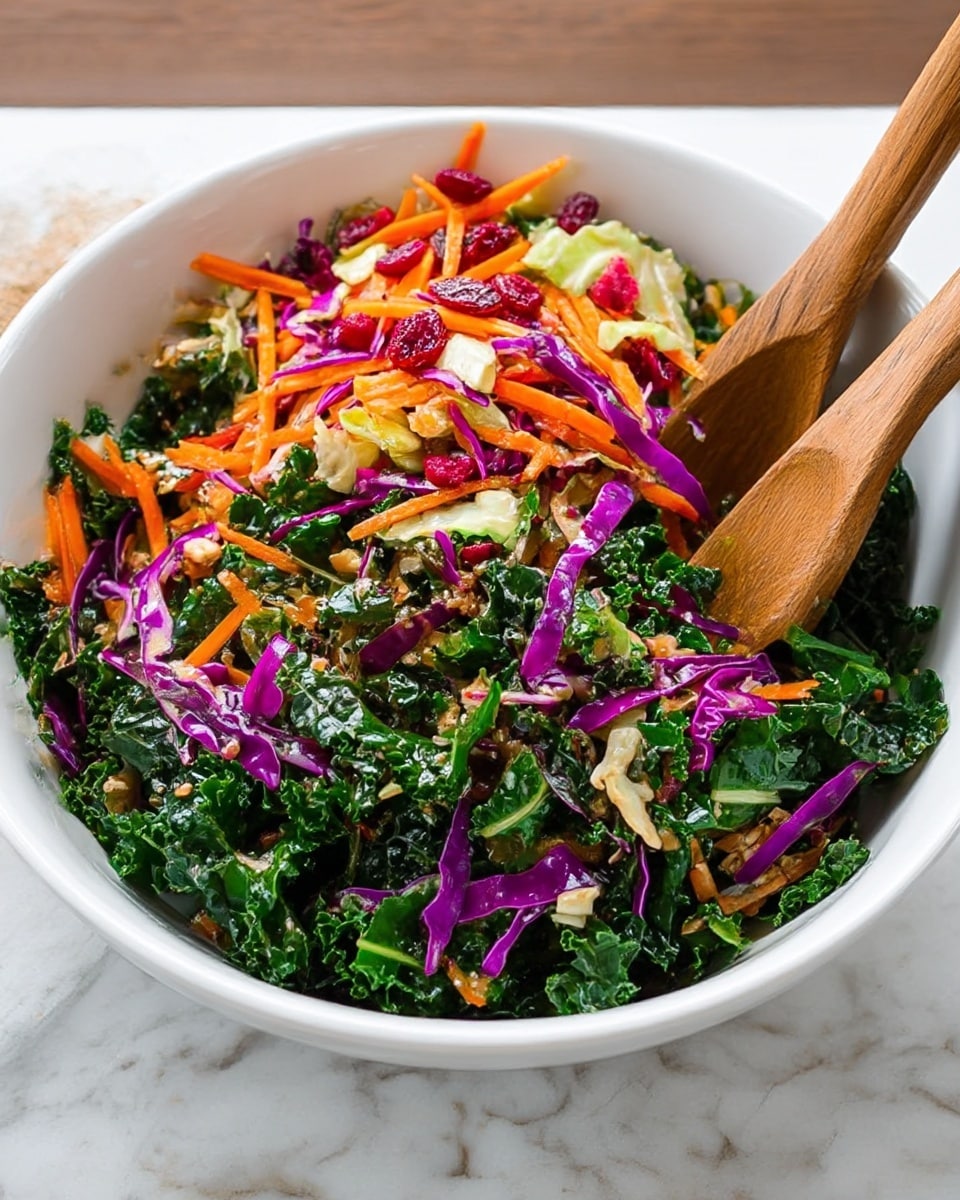 A white bowl filled with a fresh salad showing three layers: the bottom layer has dark green kale leaves with a curly texture, the middle layer has thin strips of bright purple cabbage, and the top layer has shreds of orange carrot mixed with small red berries and some light green cabbage pieces, all resting on a white marbled surface, with wooden salad tongs partially visible inside the bowl. Photo taken with an iphone --ar 4:5 --v 7