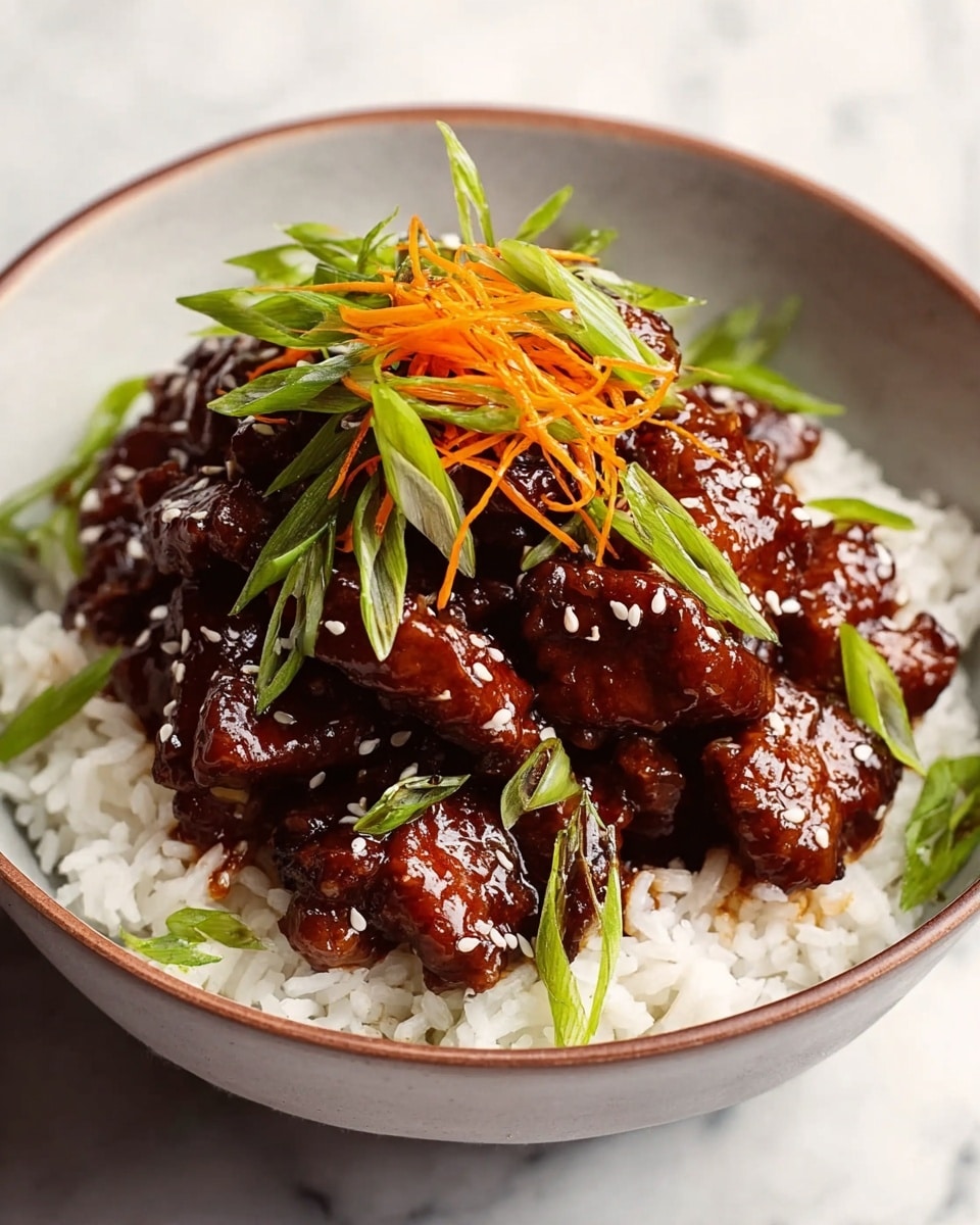 A white bowl filled with a base layer of fluffy white rice, topped with thick, glossy pieces of dark brown glazed meat arranged in a small mound. On top of the meat, there are thin, bright green sliced scallions and delicate orange shredded carrot strips scattered neatly. The glossy sauce on the meat reflects light, showing a sticky texture, with some white sesame seeds sprinkled over it. The bowl rests on a white marbled surface, enhancing the dish's vibrant colors and textures. Photo taken with an iphone --ar 4:5 --v 7